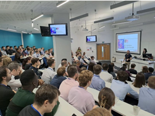 Participants in the our Big Summer Generative AI Hack 2023 taking their instructions