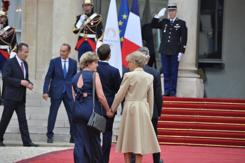 Menna Rawlings and Bridgitte Macron walk hand in hand down the red carpet and towards the Elysee Presidential Palace in Paris for the opening ceremony of the Paris 2024 Olympic Games.